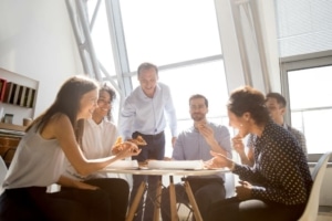 Group of employees looking happy during a meeting