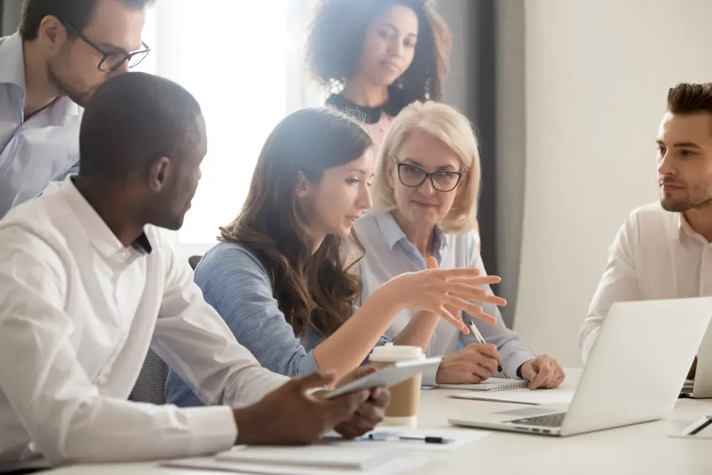 A team of workers in an office that practices great strategic employee engagement