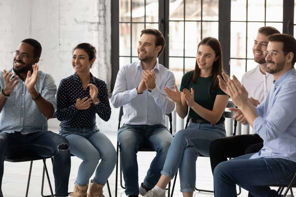 Employees clapping for other employees